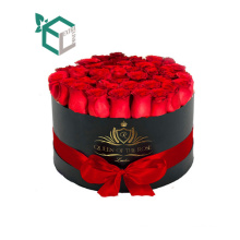 Chine Fournisseur Rond New Premium Black Foil Emboutage Personnalisé Carton Fleur Tube Cadeau Boîte Avec Poignée Ruban